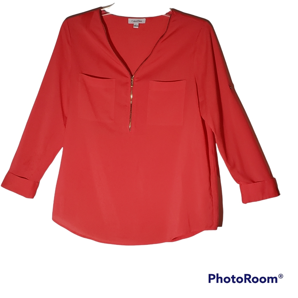 Calvin Klein ladies large solid orange front zipper two pocket blouse. 256